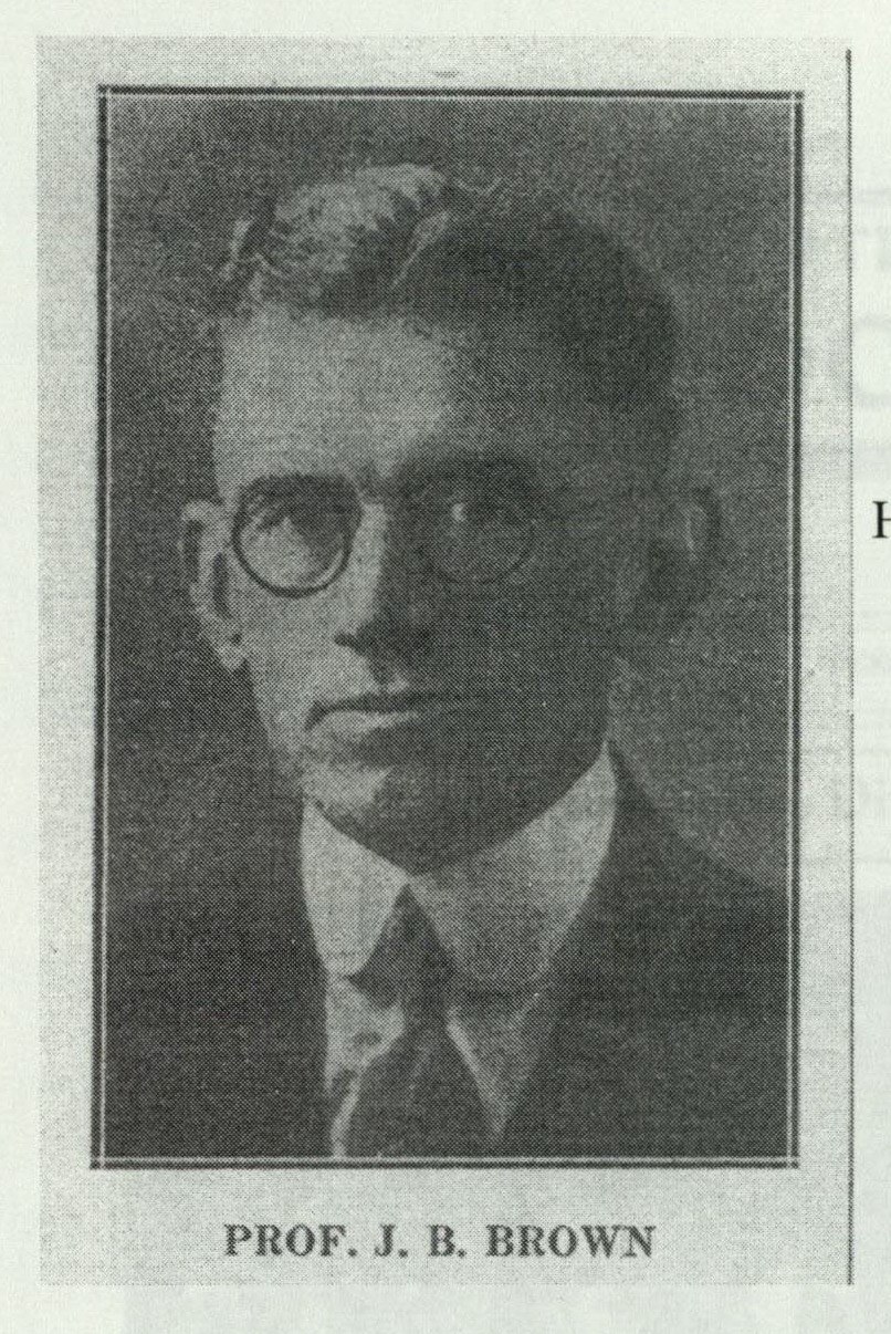 Portrait photograph of Professor J. B. Brown in glasses and a dark suit, framed as a memorial portrait