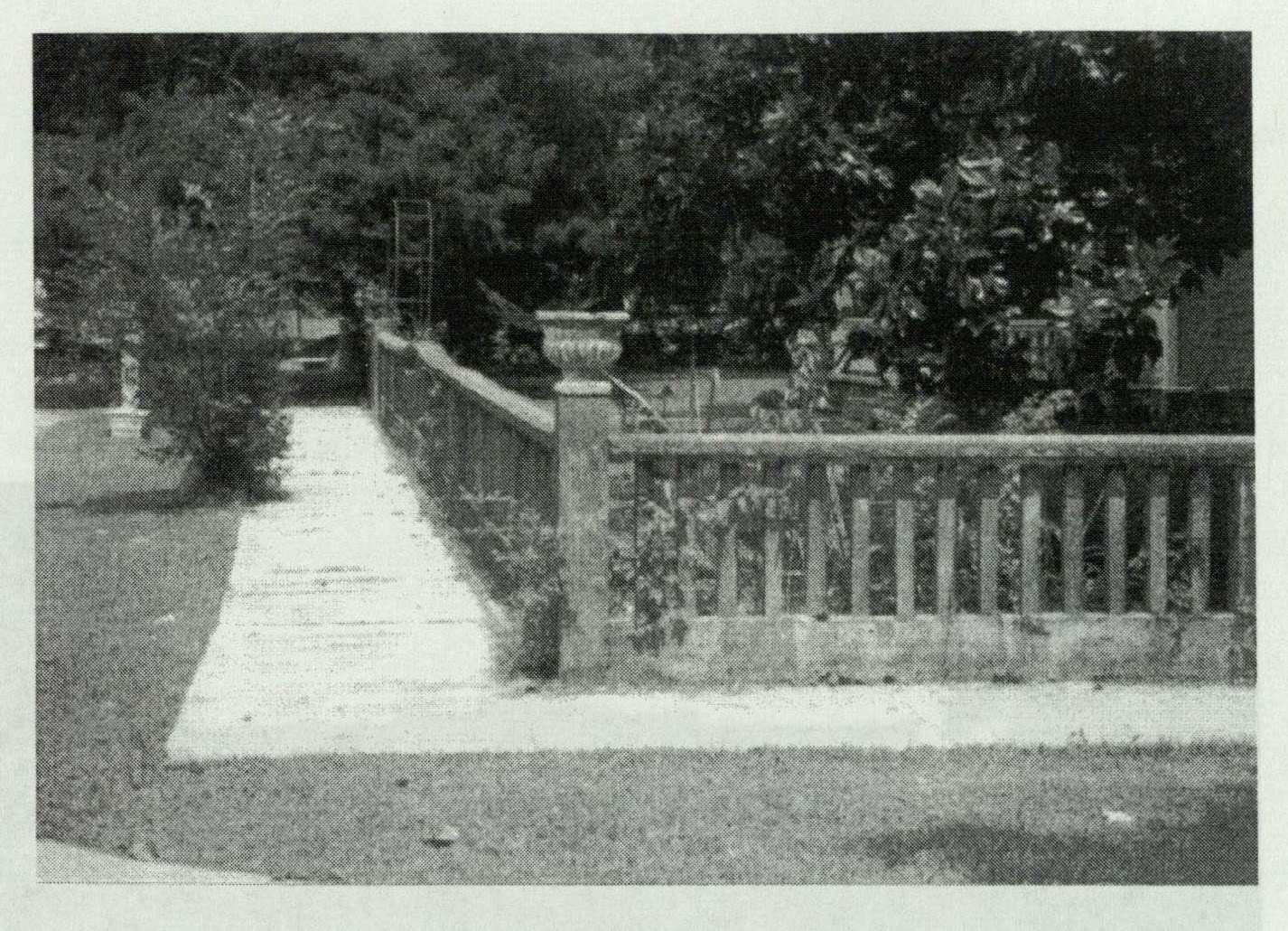 Cement fencing along a Richard City street