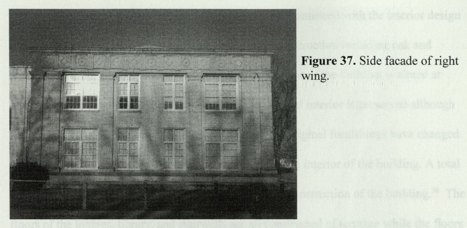Side facade of the right wing with paired window bays, decorative pilasters, and diamond-and-bullseye frieze