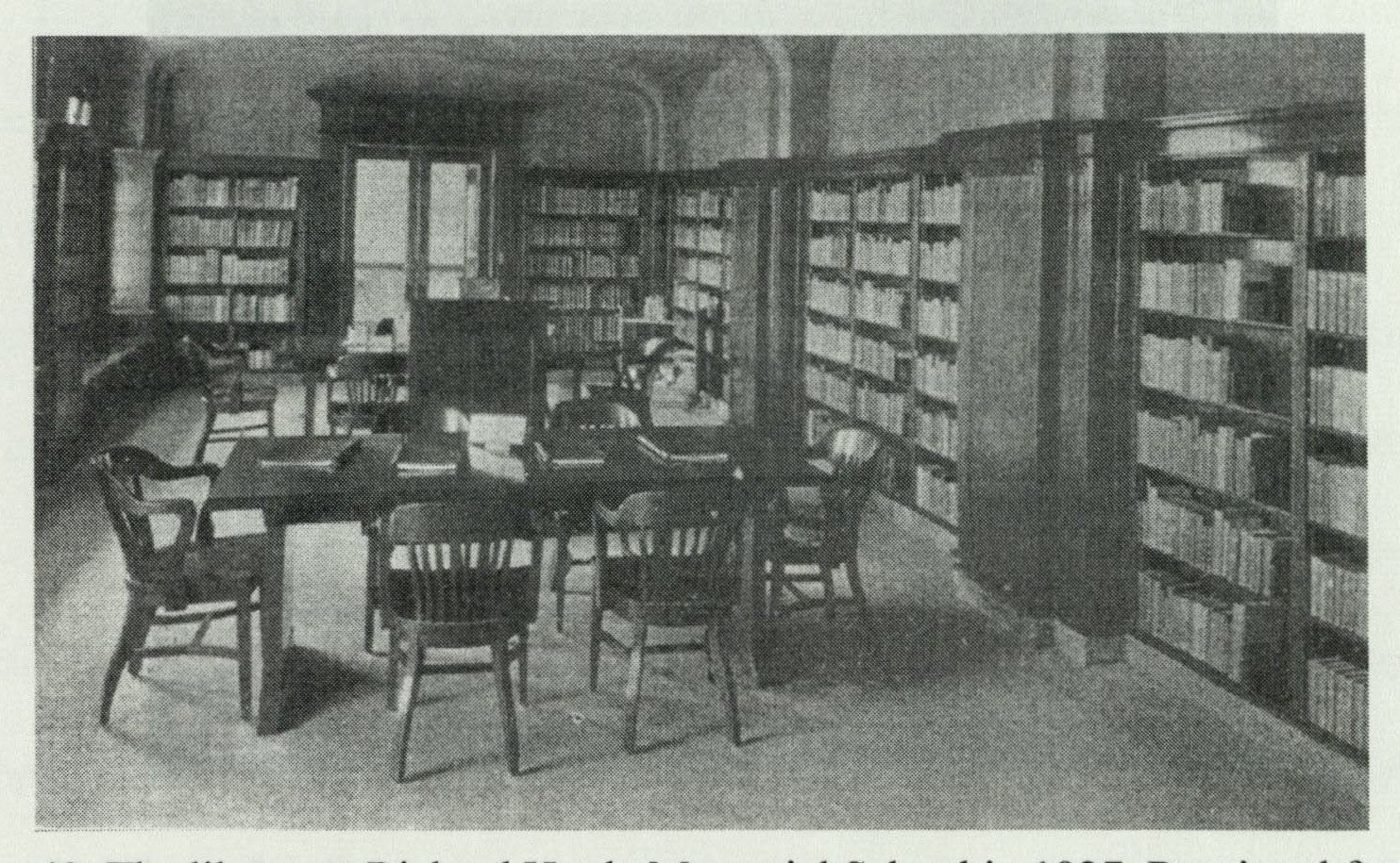 1927 interior view of the school library with walnut shelving, window seats, and arched ceiling