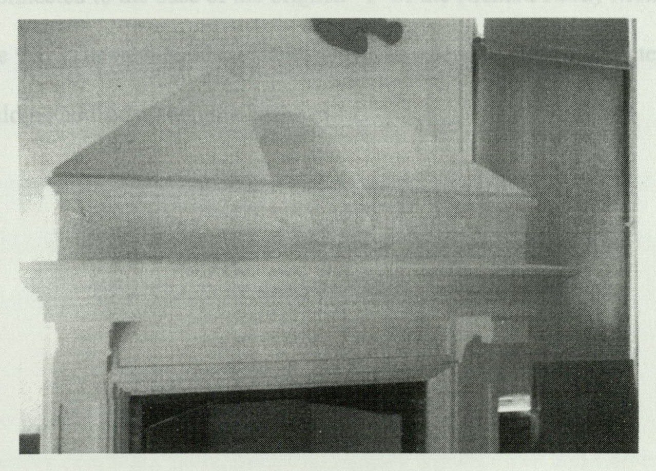 Cement-and-cast-iron fireplace in the kindergarten room, with a nursery-figure frieze along the mantel