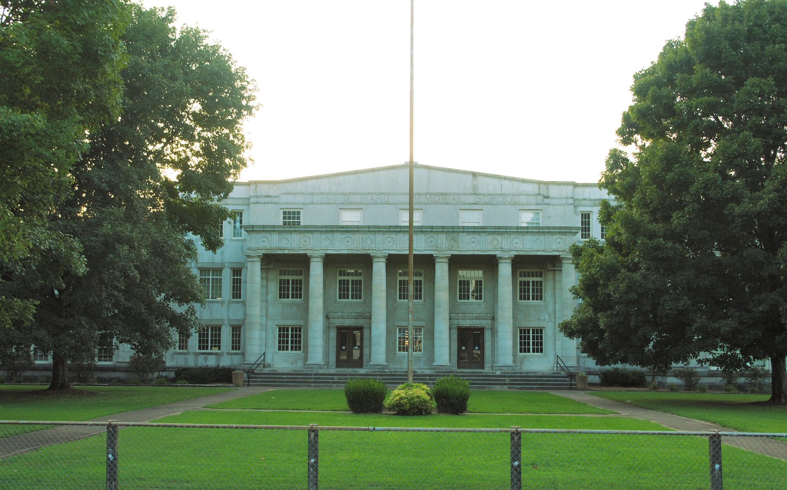 The Neoclassical front facade of Richard Hardy Memorial School, with its six-column Doric portico