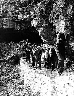 Visitors touring the Russell Cave shelter, about 1965