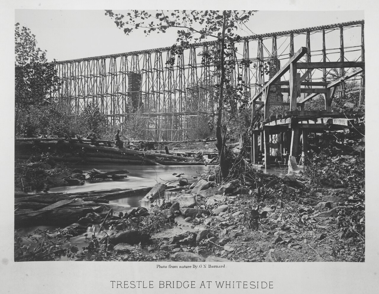 Four-tiered wooden railroad trestle bridge over Running Water Creek near Whiteside, photographed by George N. Barnard, 1864